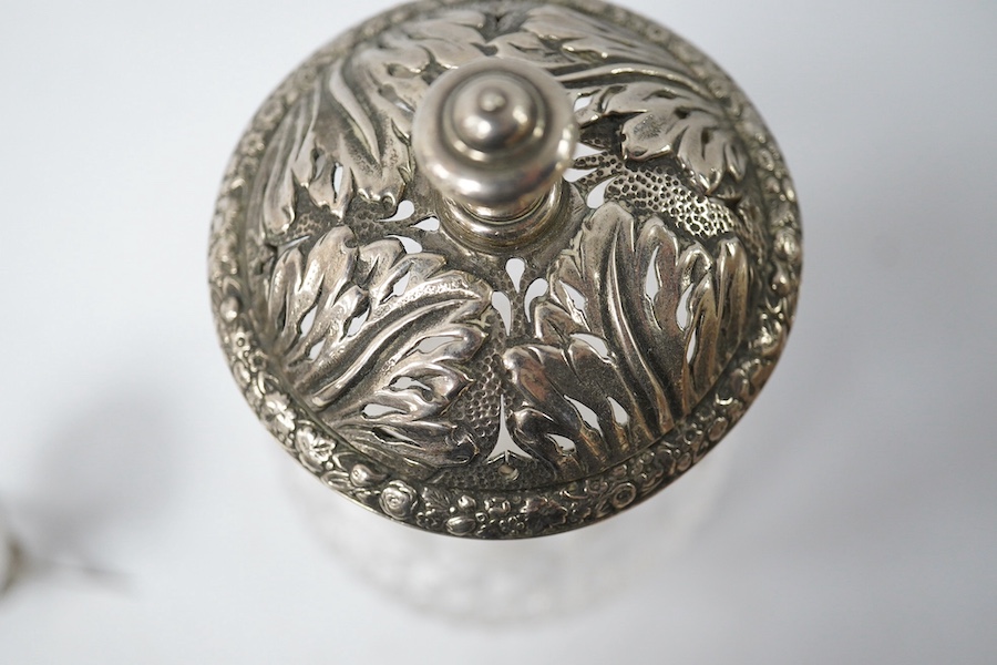 A Georgian silver mounted cut glass caster, London, 1818, 15.7cm, together with a Japanese silver condiment on tripod supports, import marks for Harrods Ltd, London, 1920. Condition - poor to fair